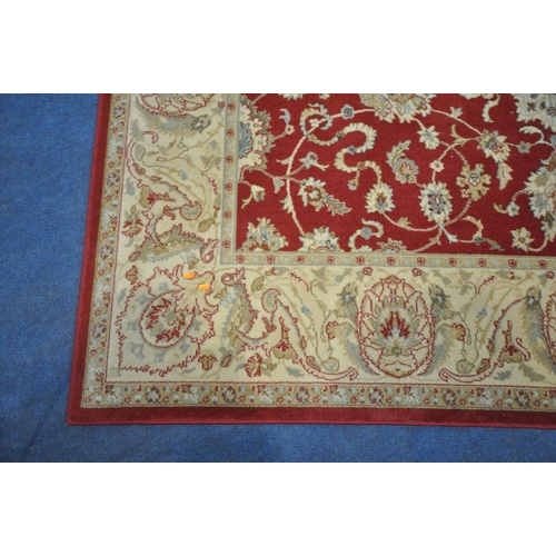 1213 - A PRADO RUGS KASHIMAR RUG, with repeating foliate patterns, surrounded by a multi-strap border, 235c... 