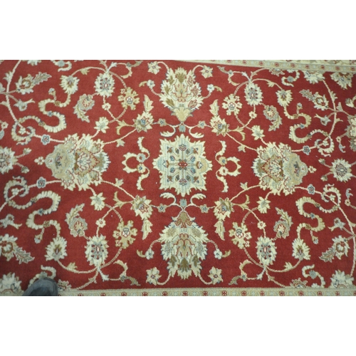 1213 - A PRADO RUGS KASHIMAR RUG, with repeating foliate patterns, surrounded by a multi-strap border, 235c... 