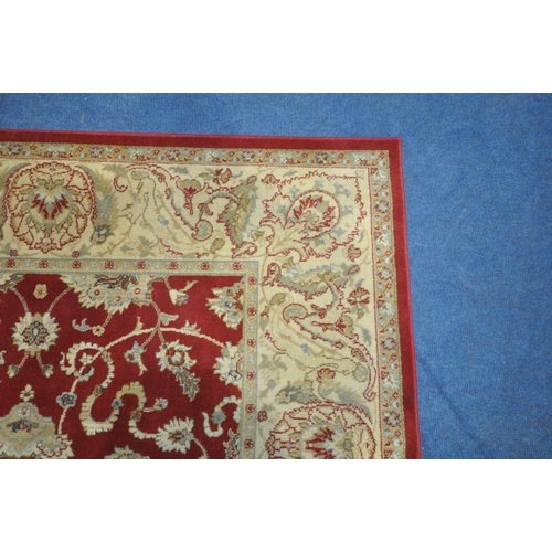 1213 - A PRADO RUGS KASHIMAR RUG, with repeating foliate patterns, surrounded by a multi-strap border, 235c... 