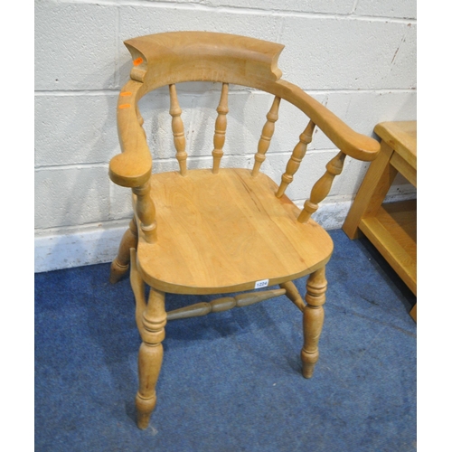 1224 - A LATE 20TH CENTURY BEECH BOW TOP SMOKERS CHAIR, the swept armrests with turned supports, raised on ... 