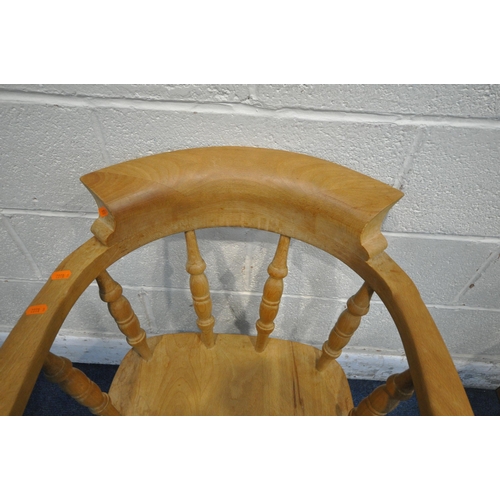 1224 - A LATE 20TH CENTURY BEECH BOW TOP SMOKERS CHAIR, the swept armrests with turned supports, raised on ... 