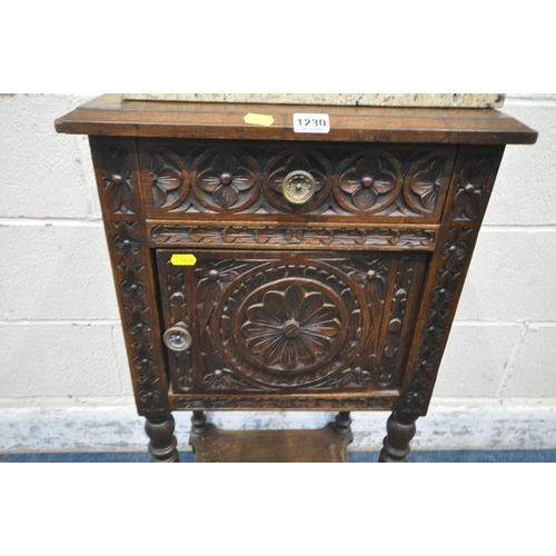 1230 - A 20TH CENTURY OAK POT CUPBOARD, with a single drawer, above a cupboard door, with geometric carved ... 