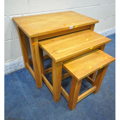 1234 - A SOLID OAK NEST OF THREE TABLES, largest table width 70cm x 43cm x height 60cm (condition report: m... 