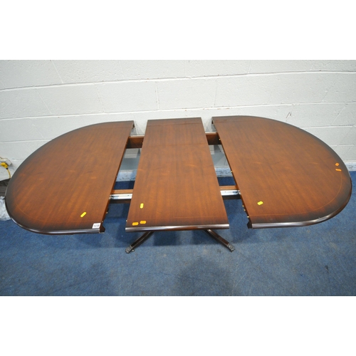 1238 - A BRADLEY MAHOGANY OVAL EXTENDING DINING TABLE, with one additional leaf, raised on a single pedesta... 