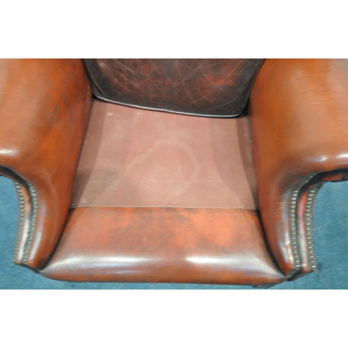 1241 - AN OXBLOOD BUTTONED LEATHER CHESTERFIELD WINGBACK ARMCHAIR, with scrolled armrests, width 87cm x dep... 