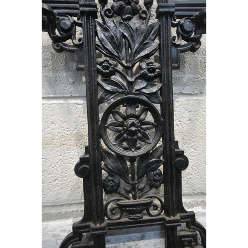 1247 - A BLACK PAINTED CAST IRON STICK / UMBRELLA STAND, with scrolled and foliate details, width 42cm x de... 