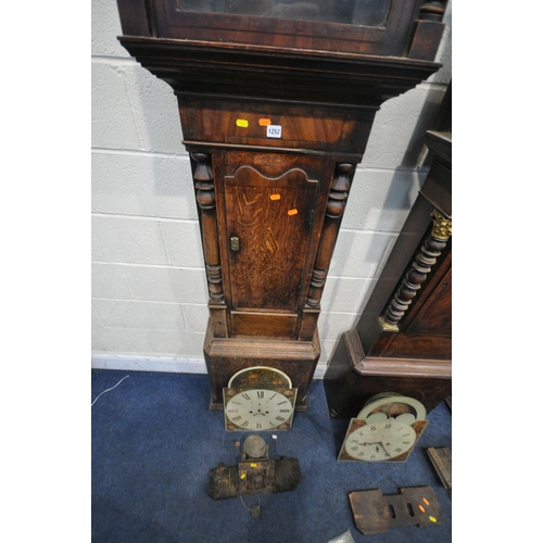 1252 - THE GEORGIAN LONGCASE CLOCKS, one oak and one mahogany, a hood, three dials, three movements, three ... 