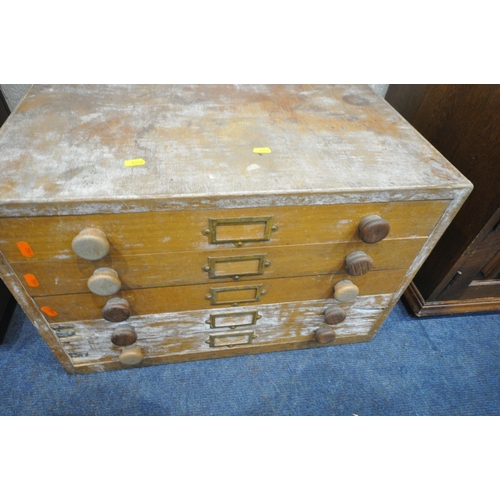 1254 - A LATE 20TH CENTURY OAK MEDIA CABINET, with a hinged lid, single lead glazed door, above a linenfold... 