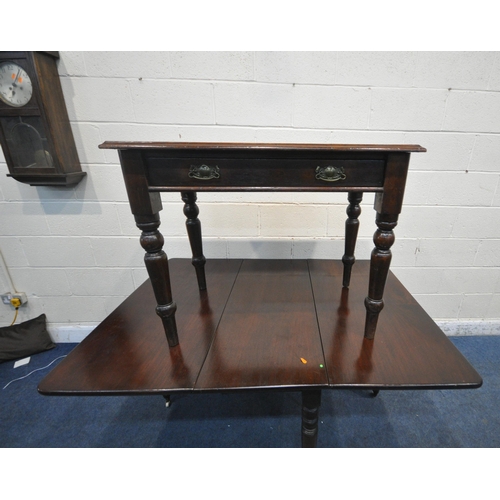 1256 - AN EARLY 20TH CENTURY MAHOGANY DROP LEAF TABLE, raised on turned legs, open width 147cm x closed wid... 