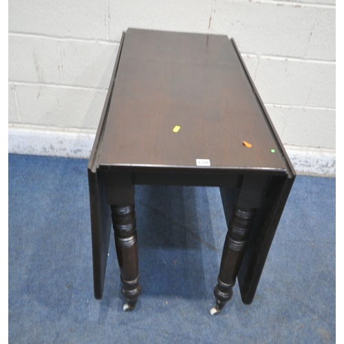 1256 - AN EARLY 20TH CENTURY MAHOGANY DROP LEAF TABLE, raised on turned legs, open width 147cm x closed wid... 