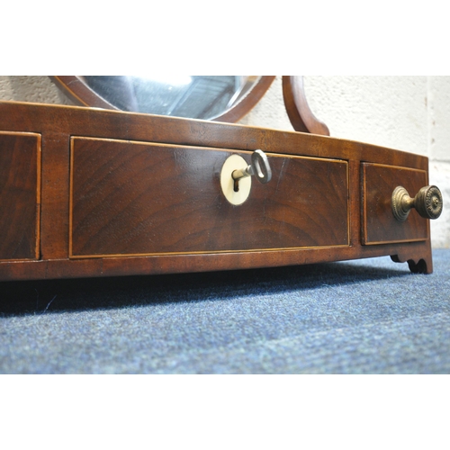 1258 - A 19TH CENTURY MAHOGANY DRESSING TABLE MIRROR, with a bow front base, fitted with three drawers, alo... 