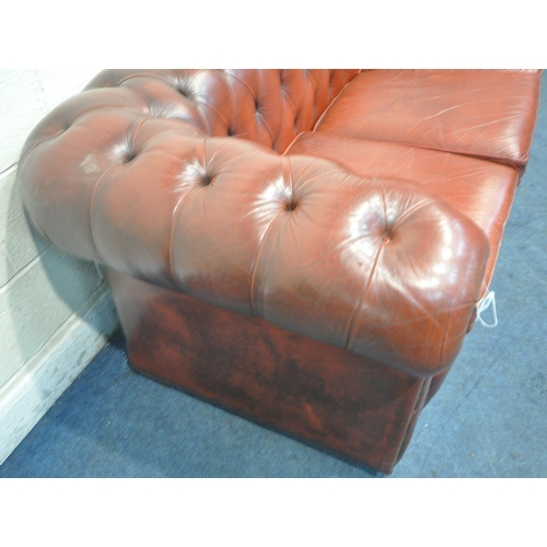 1263 - AN OXBLOOD LEATHER CHESTERFIELD THREE SEATER SOFA, with buttoned back and armrests, length 230cm x d... 