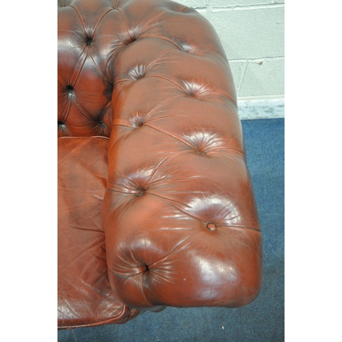 1263 - AN OXBLOOD LEATHER CHESTERFIELD THREE SEATER SOFA, with buttoned back and armrests, length 230cm x d... 