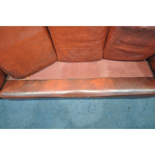 1263 - AN OXBLOOD LEATHER CHESTERFIELD THREE SEATER SOFA, with buttoned back and armrests, length 230cm x d... 