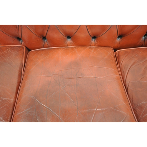 1263 - AN OXBLOOD LEATHER CHESTERFIELD THREE SEATER SOFA, with buttoned back and armrests, length 230cm x d... 