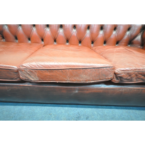 1263 - AN OXBLOOD LEATHER CHESTERFIELD THREE SEATER SOFA, with buttoned back and armrests, length 230cm x d... 