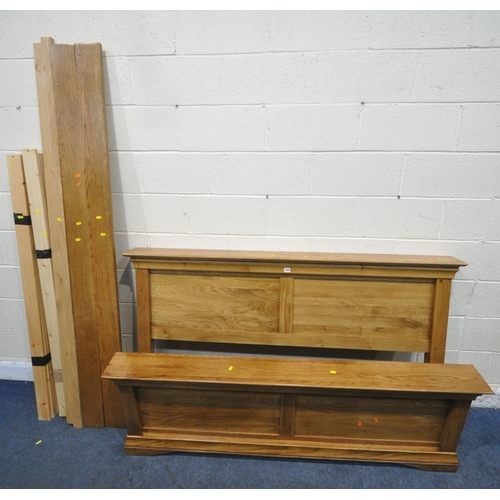 1264 - A MODERN SOLID OAK 5FT BEDSTEAD (condition report: with siderails, slats, central support, and bolts... 