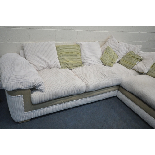 1267 - A BEIGE UPHOLSTERED JUMBO CORD CORNER SOFA, with scatter cushions, length 280cm x depth 220cm x heig... 