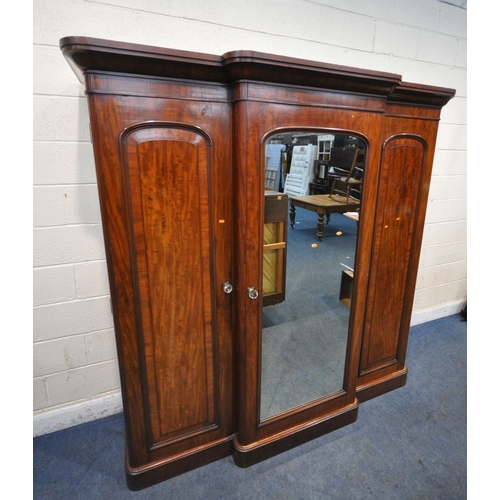 1270 - A VICTORIAN FLAME MAHOGANY BREAKFRONT TRIPLE DOOR WARDROBE, with fielded panel doors, flanking a cen... 