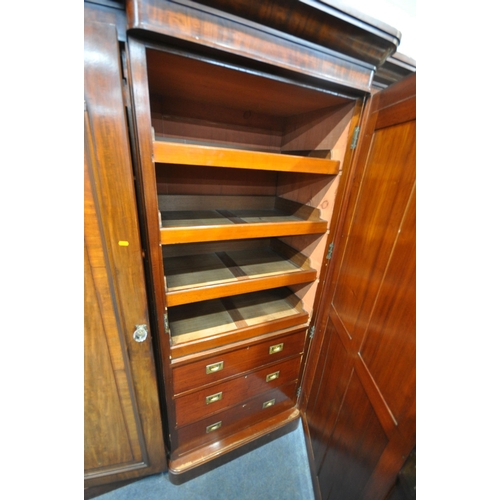 1270 - A VICTORIAN FLAME MAHOGANY BREAKFRONT TRIPLE DOOR WARDROBE, with fielded panel doors, flanking a cen... 