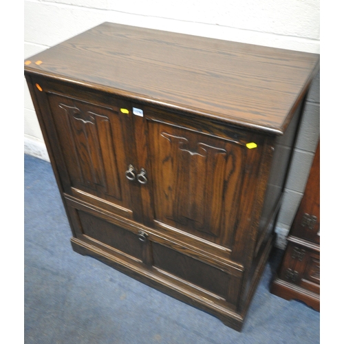 1276 - A JAYCEE OAK DOUBLE DOOR TV CABINET, with a fall front door, width 94cm x depth 54cm x height 104cm,... 