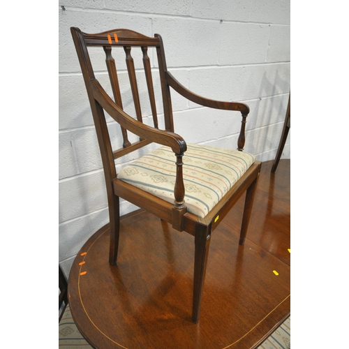 1279 - A 20TH CENTURY MAHOGANY OVAL EXTENDING DINING TABLE, with one additional leaf, raised on turned supp... 