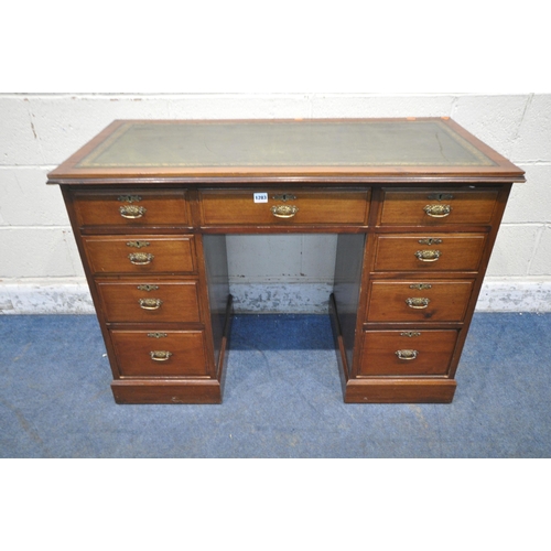 1283 - A 20TH CENTURY MAHOGANY KNEEHOLE DESK, with a green leather writing surface, fitted with nine assort... 