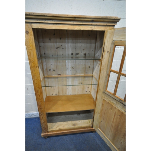 1287 - A PINE CUPBOARD, fitted with single door, thats enclosing two glass shelves, and a wooden shelf, wi... 