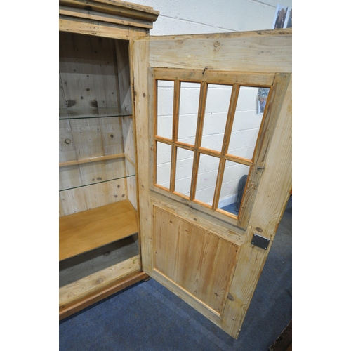 1287 - A PINE CUPBOARD, fitted with single door, thats enclosing two glass shelves, and a wooden shelf, wi... 