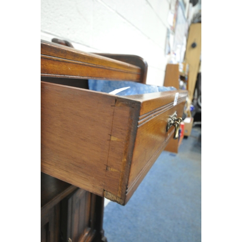 1289 - A 20TH CENTURY OAK CABINET, with a single drawer, above double cupboard doors, shaped front legs, un... 