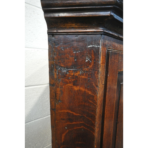 1290 - A GEORGIAN AND LATER OAK CORNER CUPBOARD ON STAND, with a single door, raised on turned front legs, ... 