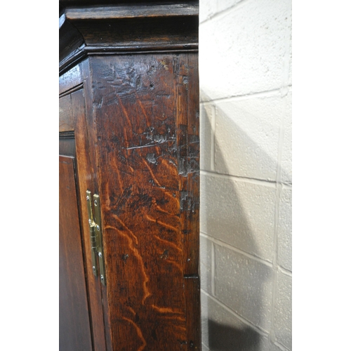 1290 - A GEORGIAN AND LATER OAK CORNER CUPBOARD ON STAND, with a single door, raised on turned front legs, ... 