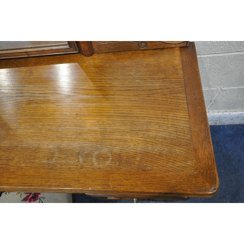 1293 - A LATE 20TH CENTURY OAK DRESSING TABLE, with a single mirror, three drawers, raised on shaped legs, ... 