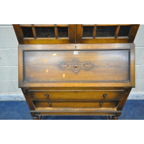 1296 - A 20TH CENTURY OAK BUREAU BOOKCASE, with double glazed doors, atop a base with a fall front door, ab... 