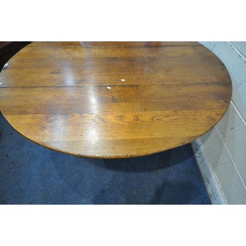 1298 - AN 18TH CENTURY STYLE OAK WAKE TABLE, raised on block and turned legs, open width 143cm x closed wid... 