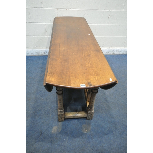 1298 - AN 18TH CENTURY STYLE OAK WAKE TABLE, raised on block and turned legs, open width 143cm x closed wid... 