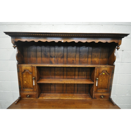 1299 - IN THE MANNER OF TITCHMARSH AND GOODWIN, AN 18TH CENTURY STYLE SOLID OAK DRESSER, the three tier pla... 