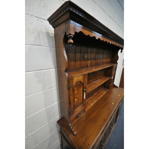 1299 - IN THE MANNER OF TITCHMARSH AND GOODWIN, AN 18TH CENTURY STYLE SOLID OAK DRESSER, the three tier pla... 