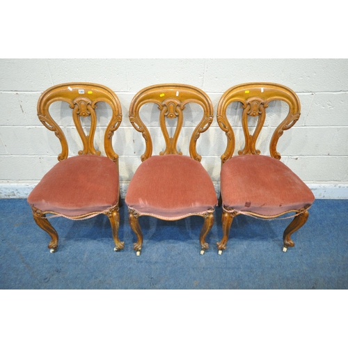 1303 - A SET OF THREE VICTORIAN CHAIRS, with shaped backrest, pink upholstery, raised on cabriole front leg... 