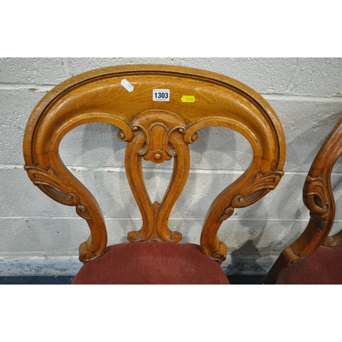 1303 - A SET OF THREE VICTORIAN CHAIRS, with shaped backrest, pink upholstery, raised on cabriole front leg... 