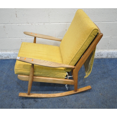 1312 - A MID CENTURY ELM ROCKING CHAIR, with yellow upholstered cushions, width 65cm x depth 86cm x height ... 