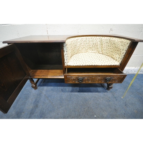 1328 - A LATE 20TH CENTURY OAK TELEPHONE SEAT, with foliate upholstery, a single linenfold door, and a sing... 