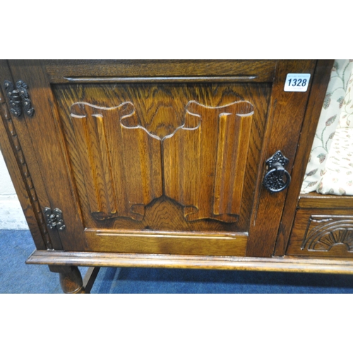 1328 - A LATE 20TH CENTURY OAK TELEPHONE SEAT, with foliate upholstery, a single linenfold door, and a sing... 