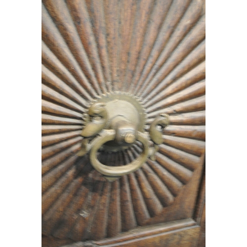 1330 - A HEAVY CARVED EASTERN HARDWOOD DOUBLE DOORS, within a moulded frame, the doors with reeded rosette ... 