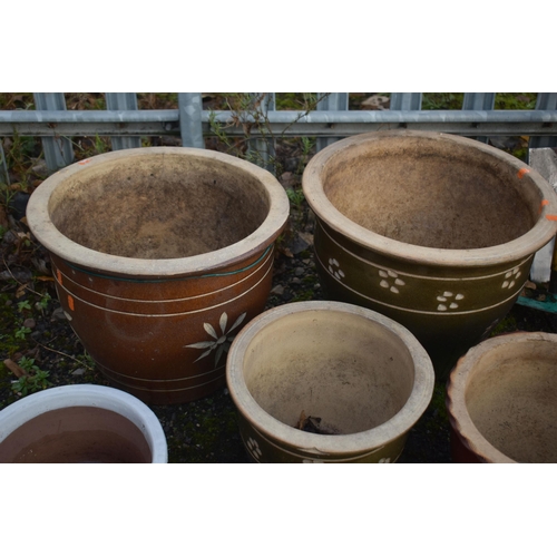 1002 - A SELECTION OF NINE GLAZED PLANT POTS, of various sizes and styles (9)