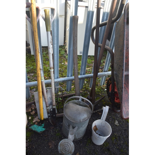 1003 - A SELECTION OF GARDEN TOOLS, to include a metal wheelbarrow, seven various garden hand tools, a galv... 