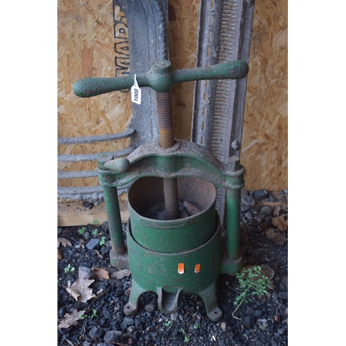 1008 - A GREEN PAINTED CAST IRON FRUIT PRESS, along with a cast iron fire place insert and a fire grill, al... 