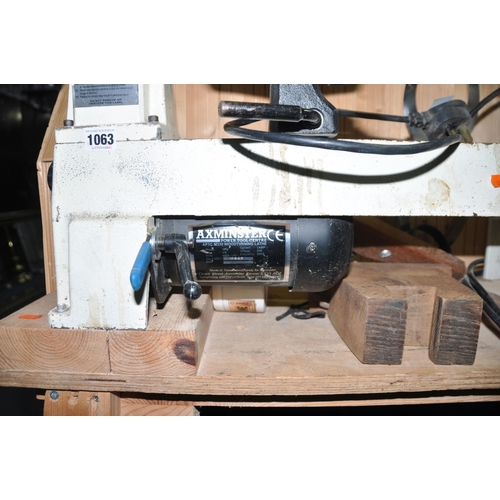 1063 - AN AXMINSTER M330 WOODTURNING LATHE ON A BESPOKE WOODEN STAND, with 33cm centre bed length (PAT pass... 