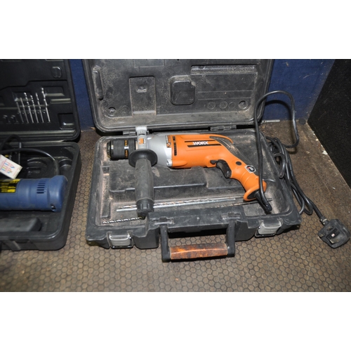 1065 - A SELECTION OF BOXED POWER TOOLS comprising of a Worx WX8HD drill, a Black and Decker angle grinder,... 