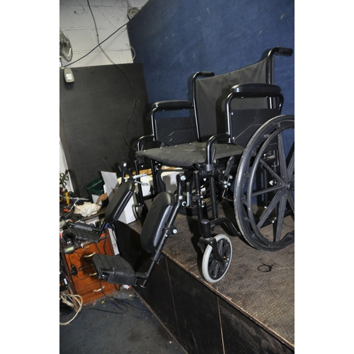 1083 - A WIDE HEAVY DUTY FOLDING WHEELCHAIR width of seat 61cm, with two adjustable footrests with calf sup... 